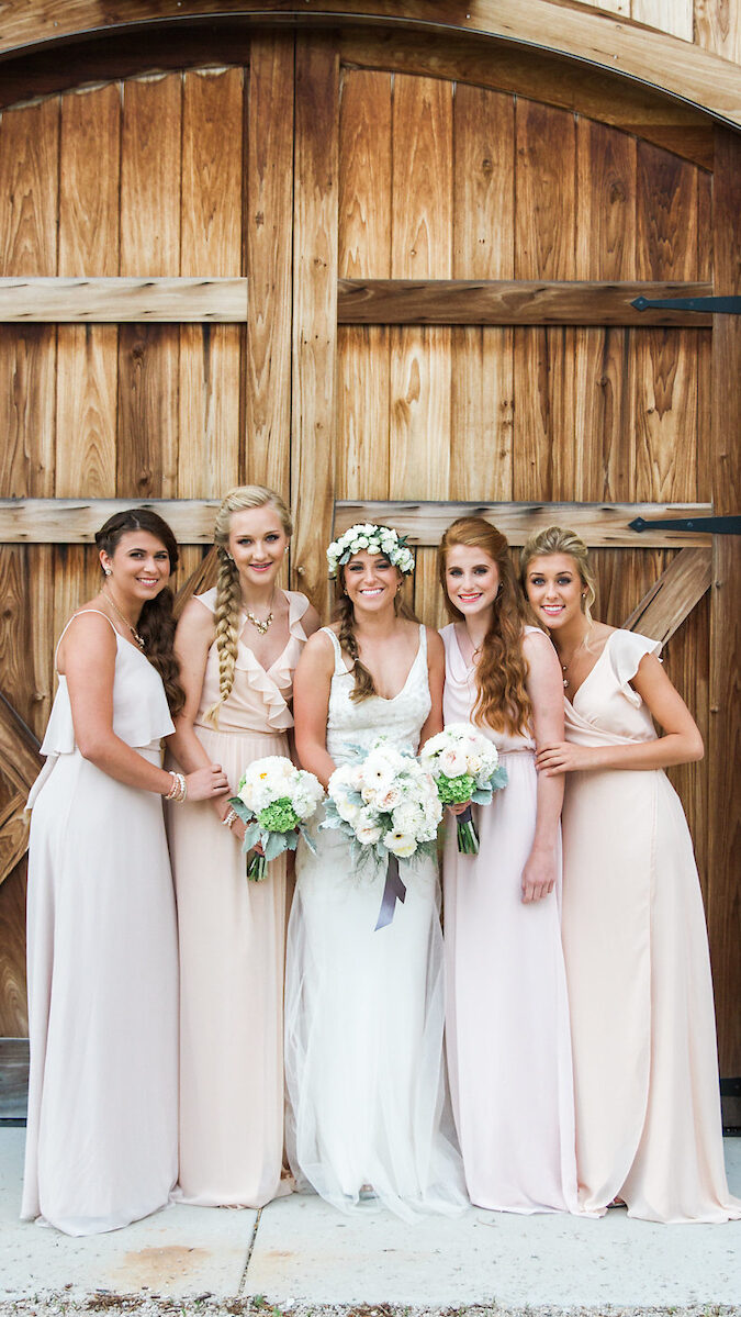 A bride and her bridesmaids take photos for the wedding.