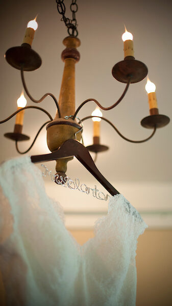 A dress hanging from the chandelier in the Bridal dressing room in Interpretation building