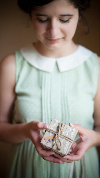 a girl holding a box - Bridal dressing room in Interpretation building