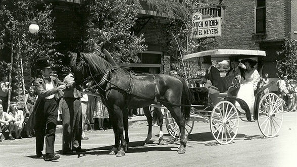 Canopy-top surrey from the Wesley W. Jung carriage collection, Sheboygan, WI, driven by Kenn Lockhart in the Spring Green Centennial Parade, July, 1957. Passengers are Frank Lloyd Wright and Oglivanna Wright. (Photo by Michael A. Vaccaro, "Look" Magazine, courtesy of the Library of Congress)